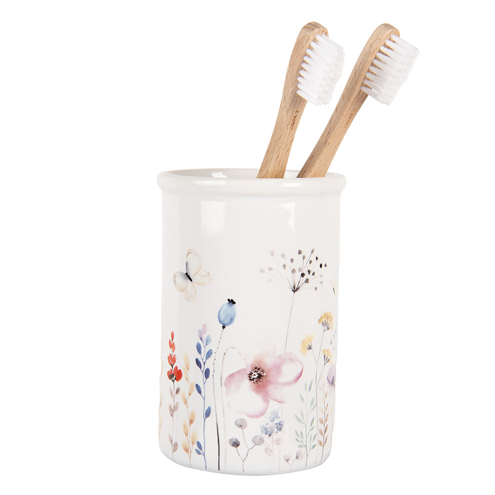 Toothbrush holder with floral motif made of ceramic in white