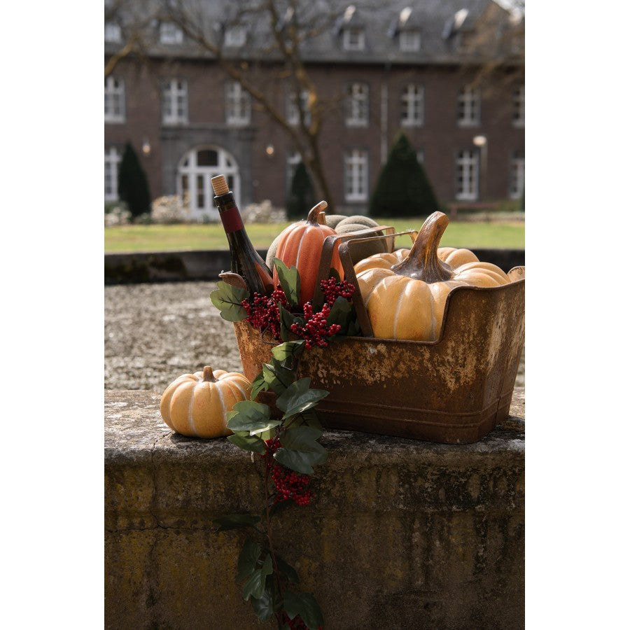 Decorazione di zucca per l'autunno realizzata in ceramica di colore arancione 